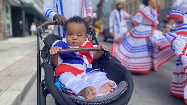 Baby⁢ of Dominican origin at a Latino event in Toronto.