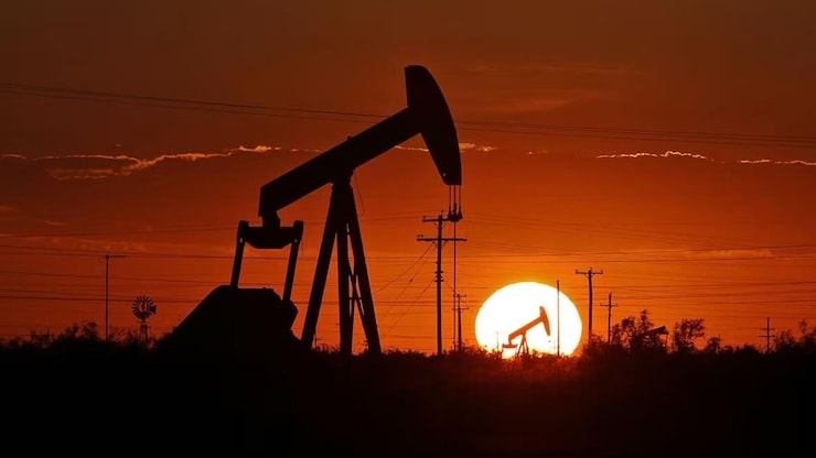 A pump jack works in an oil field. alberta releases surplus $ 8.3