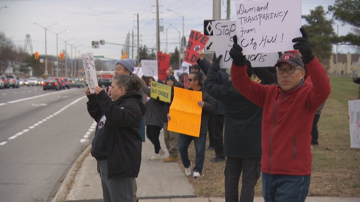 The proposal to build newcomer welcoming centres proved controversial, with several rallies held in recent months against the plan — including this protest near the Nepean Sportsplex last November. 