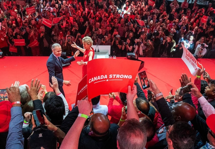 Prime Minister Mark Carney and his wife Diana Fox Carney take the stage.