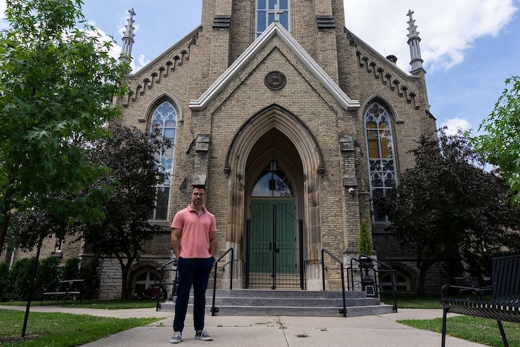 A man in front of a church.
