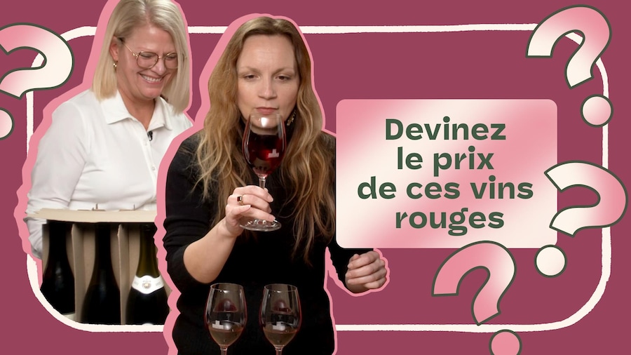 Une femme en train de goûter un vin rouge.