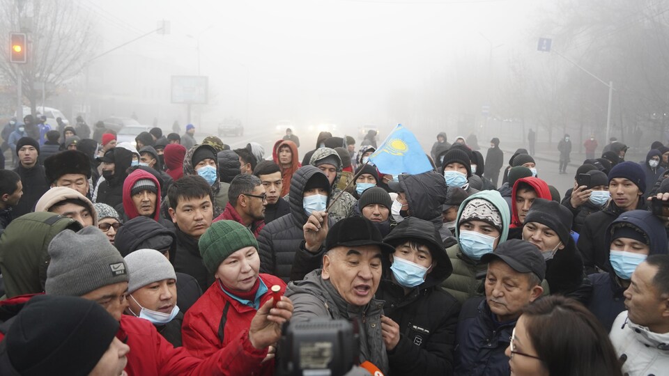 A group of protesters, one of whom was holding a police bullet, in Almaty, Kazakhstan.