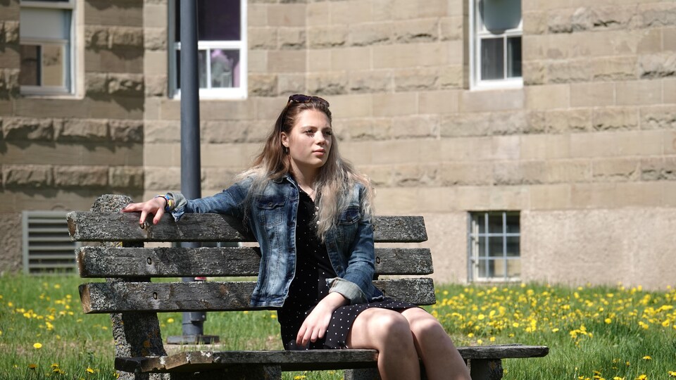 Anastasia Zaeits sitting on a bench. 