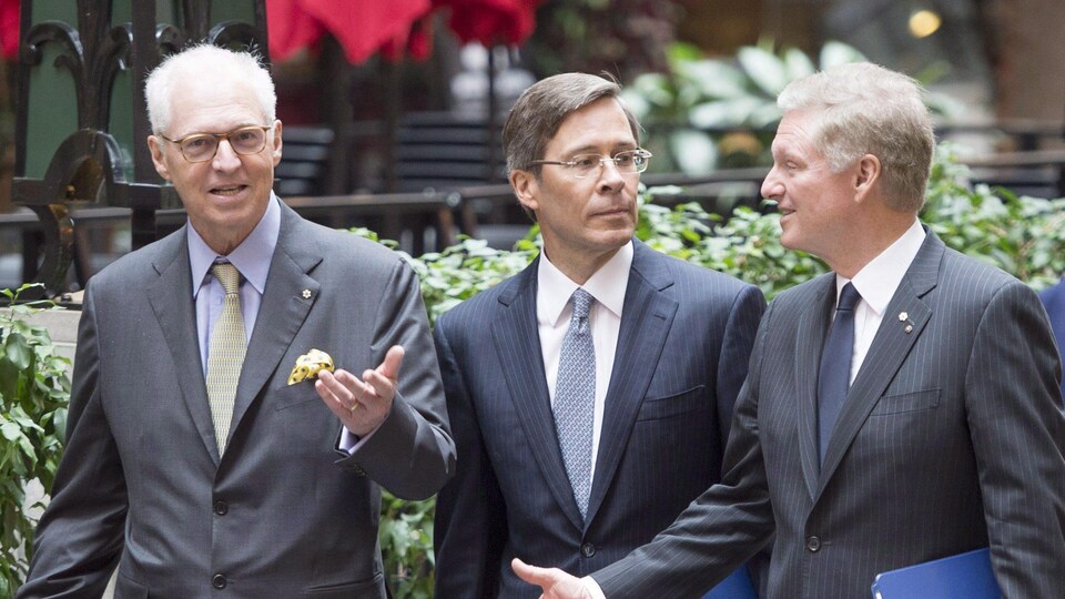 André Desmarais, Robert Jeffrey Orr et Paul Desmarais Jr. en 2019.