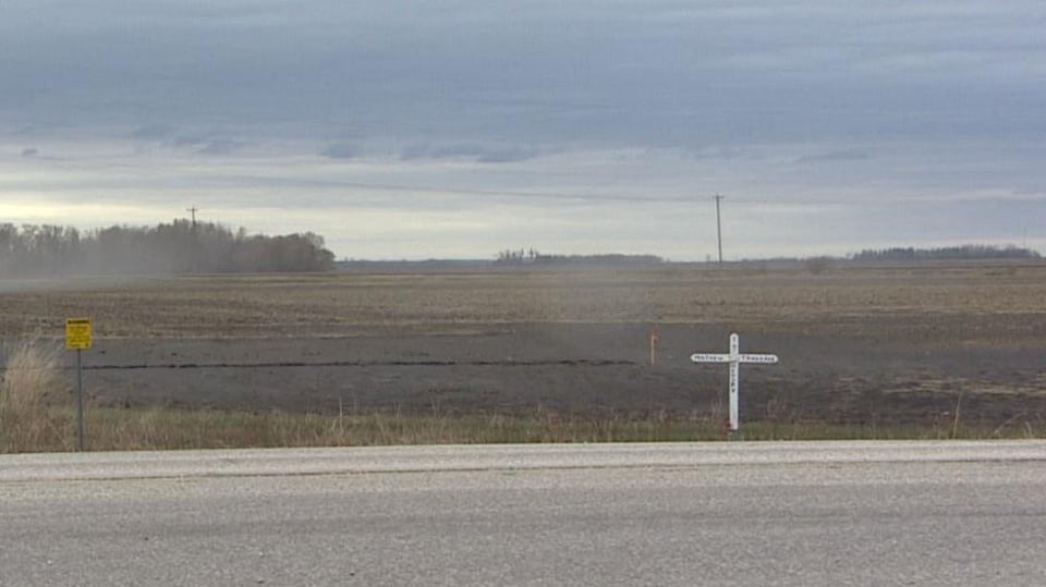 A white cross was installed along Highway 6.