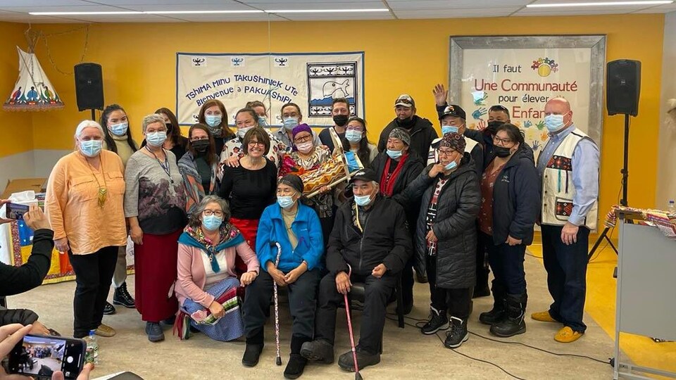 About twenty people posed for the photo,