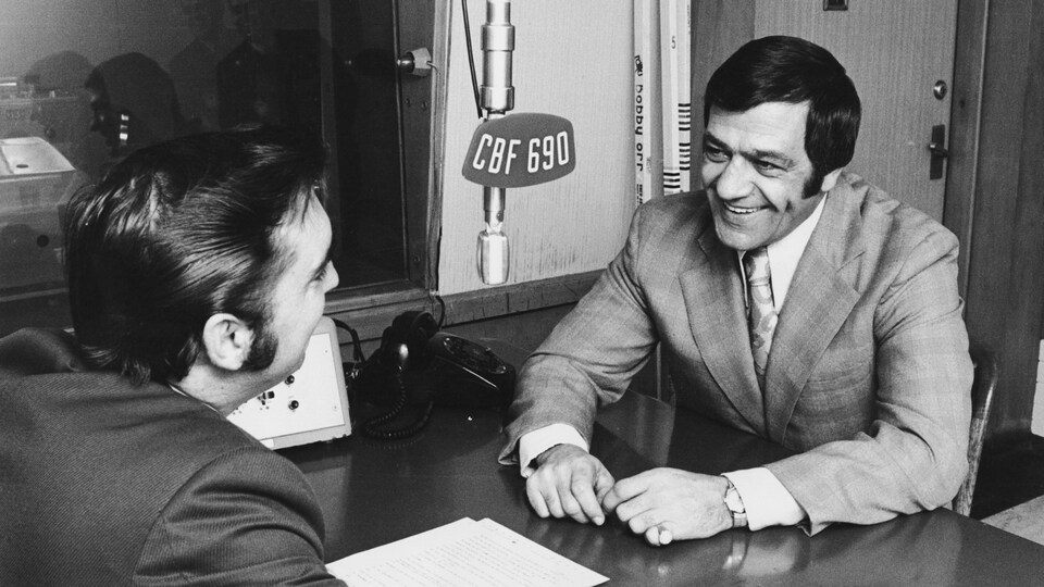 Bernard Geoffrion, souriant, avec Lionel Duval.