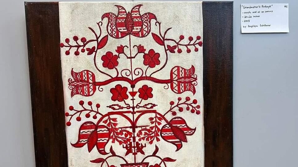 Représentation d'une broderie en pointe de croix.