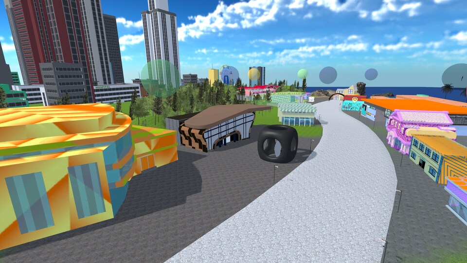 Vue aérienne du campus virtuel avec des édifices de toutes les couleurs et une route.