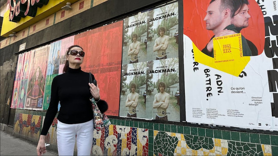 A woman in front of a building.