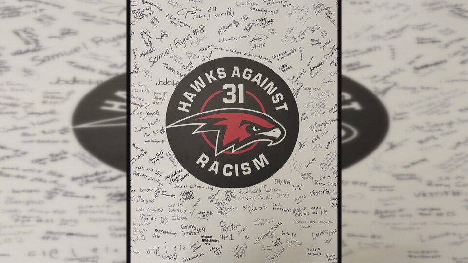 A card signed by dozens of people.