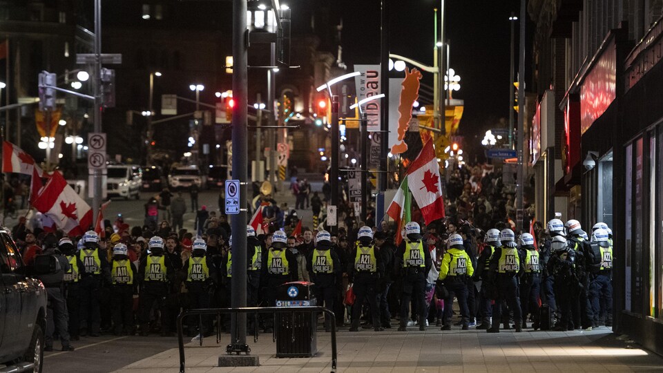 Police formed a line in front of the protesters.