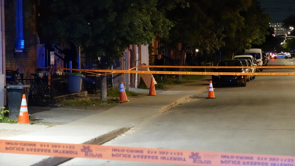 The orange tape marks a crime scene.