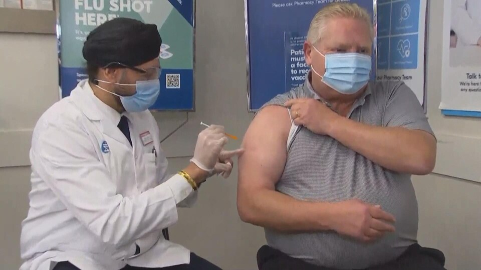 Doug Ford is vaccinated on his shoulder.