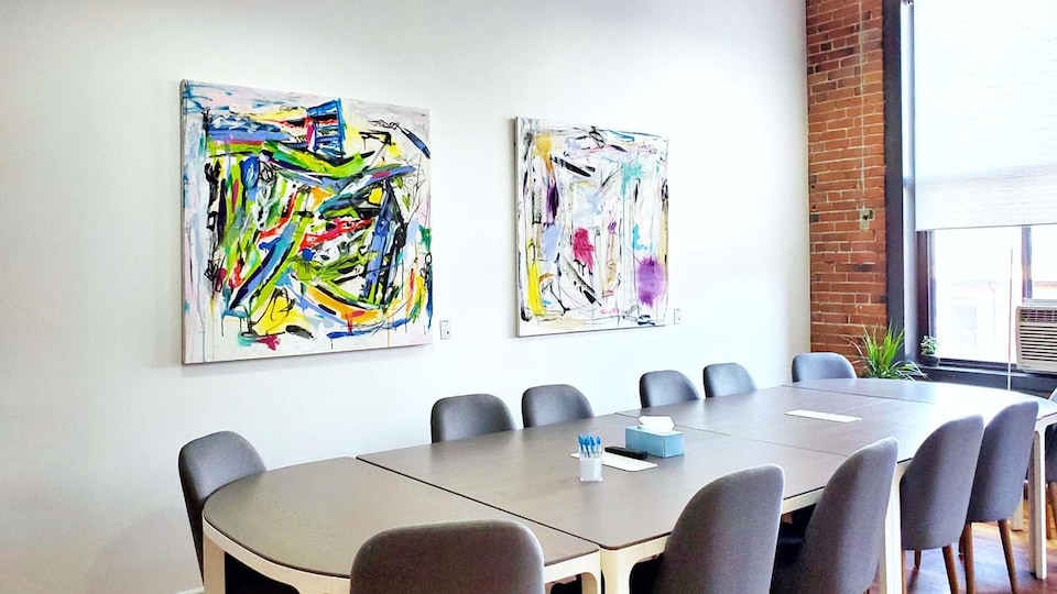 Paintings displayed in a meeting room