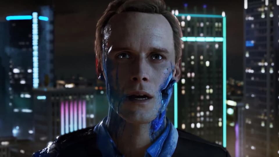 Une capture d'écran d'une bande-annonce du jeu <i>Detroit: Become Human</i> montrant un personnage humain à la mâchoire percée qui saigne du sang bleu.