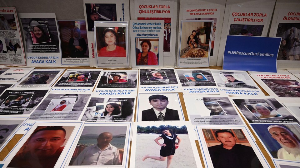 The pictures are presented on a table.