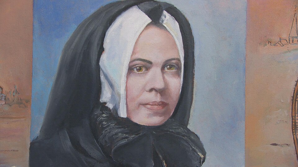 Une soeur portant une coiffe noire.