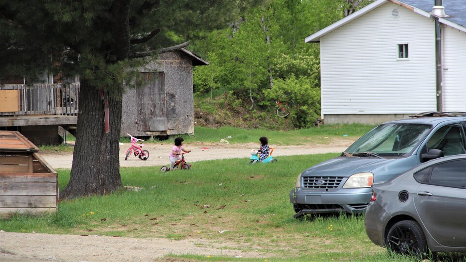 Children in the distance on bicycles.