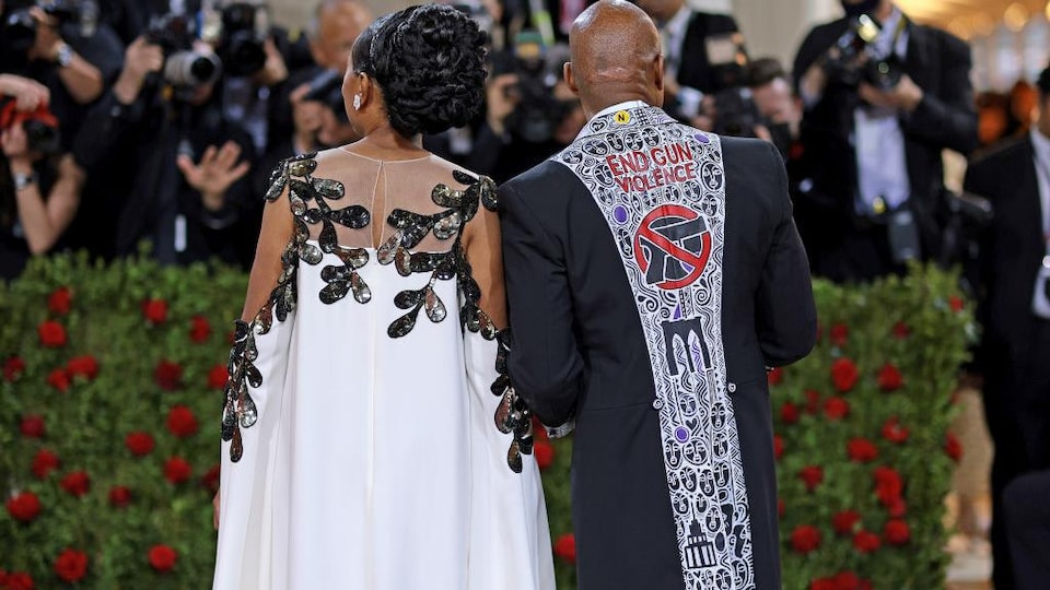 A man was wearing a suit in which it read: 