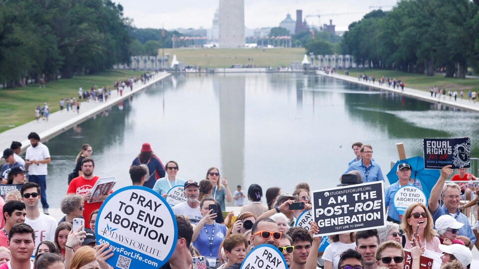 Anti-abortion protesters listen to Republican presidential candidate and former US Vice President Mike Pence speak.