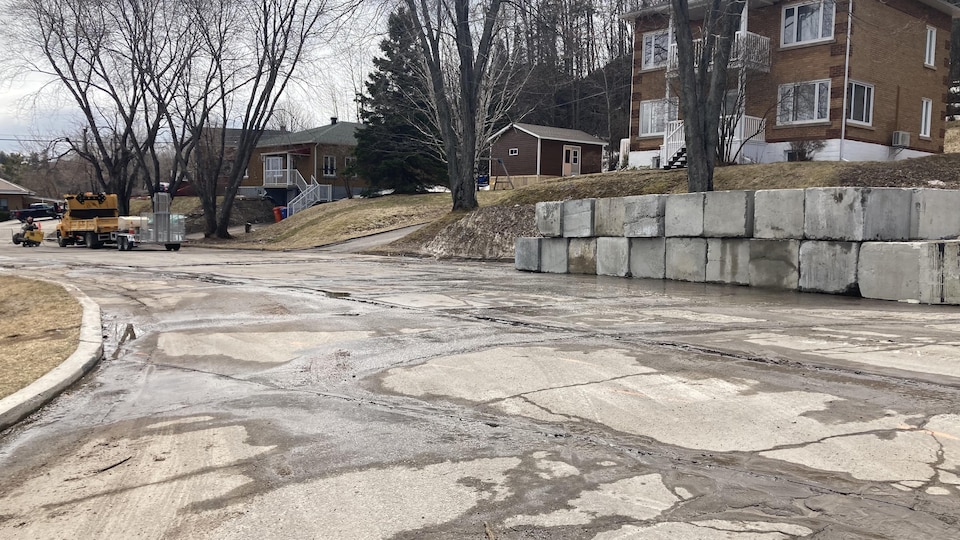 Concrete blocks installed near an embankment.