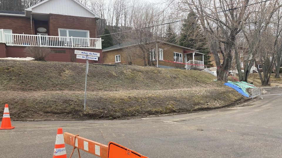A temporary fence blocks the way to a street.