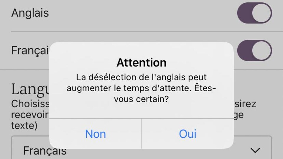 Une capture d'écran sur laquelle on peut lire le message suivant: «Attention – La désélection de l'anglais peut augmenter le temps d'attente. Êtes-vous certain?»