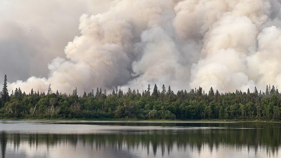 A column of smoke rose from the woods near the Bell River.