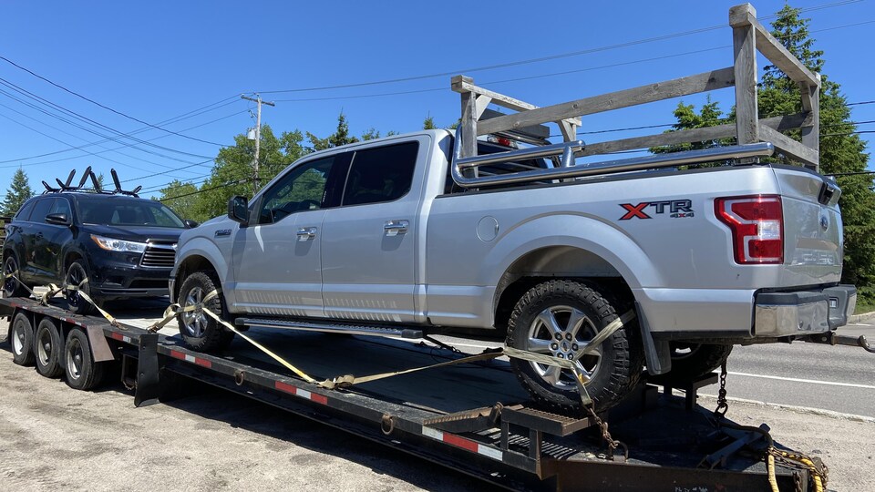 Vehicles in a tow truck.