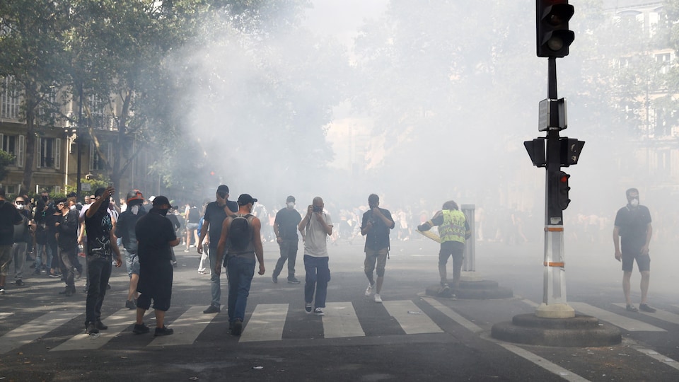 Protesters amid tear gas in Paris.