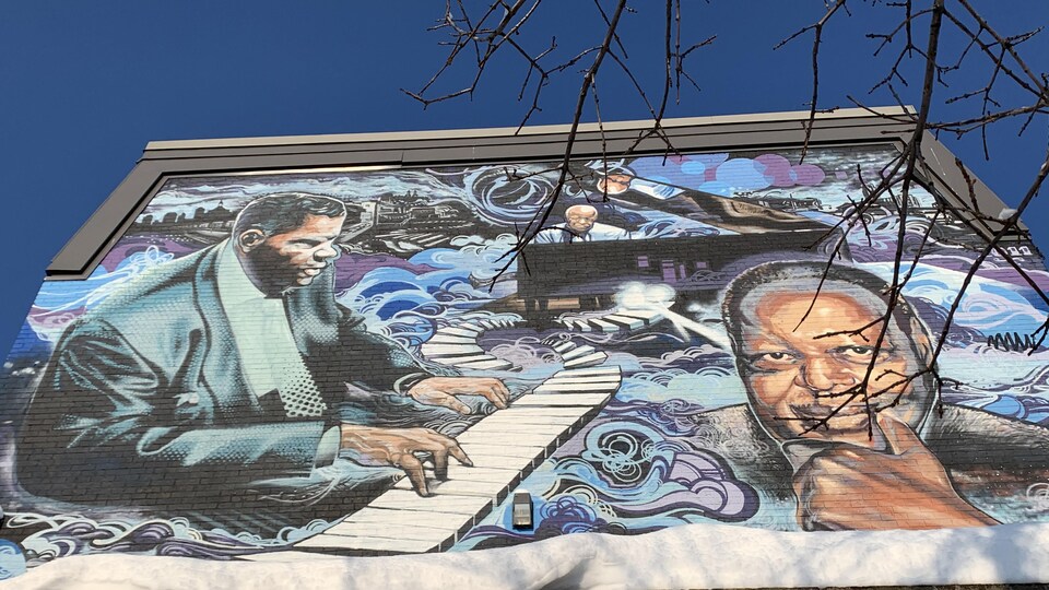 Une fresque murale dans La Petite-Bourgogne représentant des musiciens.