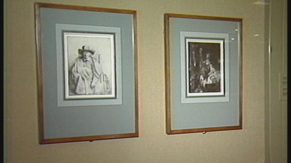Deux gravures de Rembrandt affichées sur un mur.