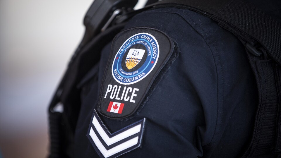 Un écusson de l'Unité mixte d'enquête sur le crime organisé.