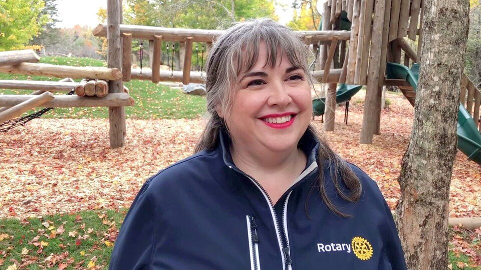 Alana Hirtle being interviewed in front of the playground.