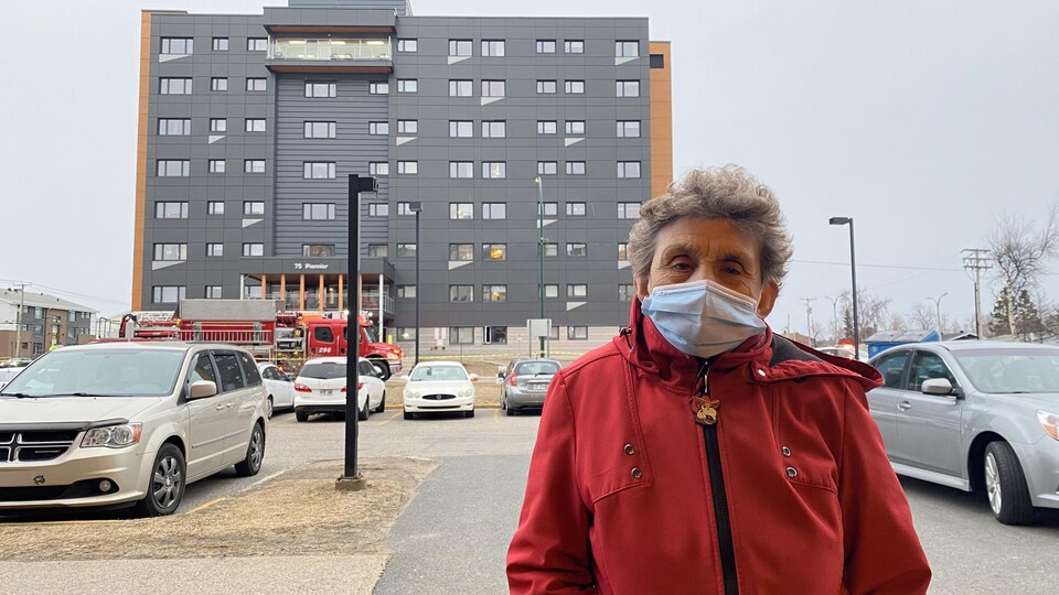 A resident is waiting to return to his residence. 