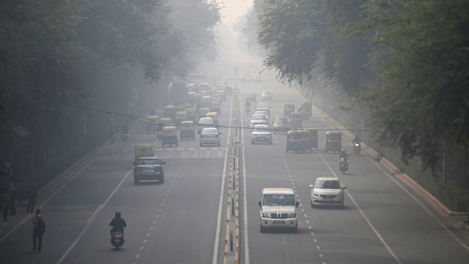 Vehicles are driving on a road.