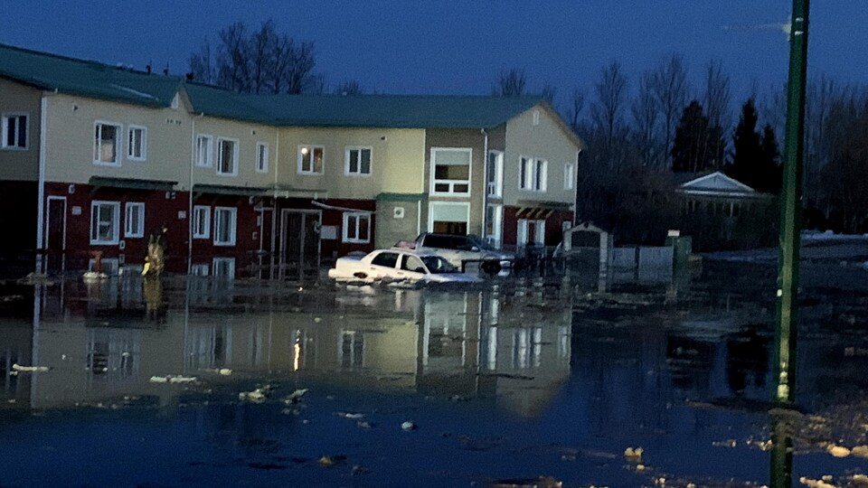 A residential complex was flooded and vehicles sank in the Hay River, May 12, 2022.