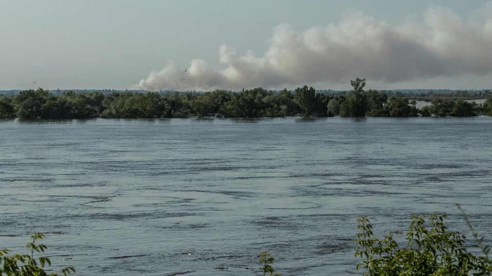 Remains of houses and rubbish are visible in the Dnipro river which overflowed after the Nova Kakhovka dam burst in Kherson.