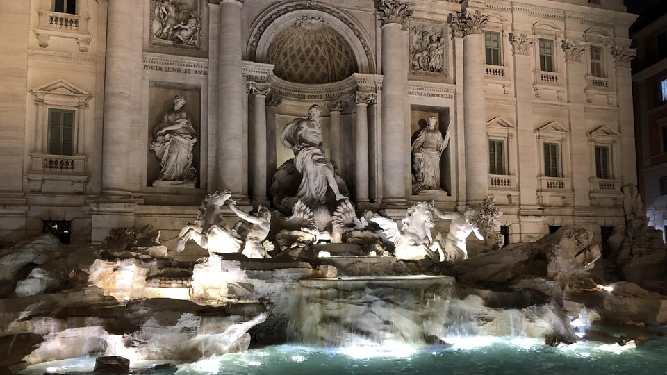 The Trevi fountain at night.