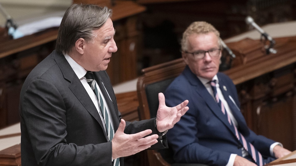 Quebec Premier Francois Legault responds to the Opposition over the Covid management, during question period Tuesday, December 1, 2020 at the legislature in Quebec City. Quebec Labour, Employment and Social Solidarity Jean Boulet, right, looks on. THE CANADIAN PRESS/Jacques Boissinot