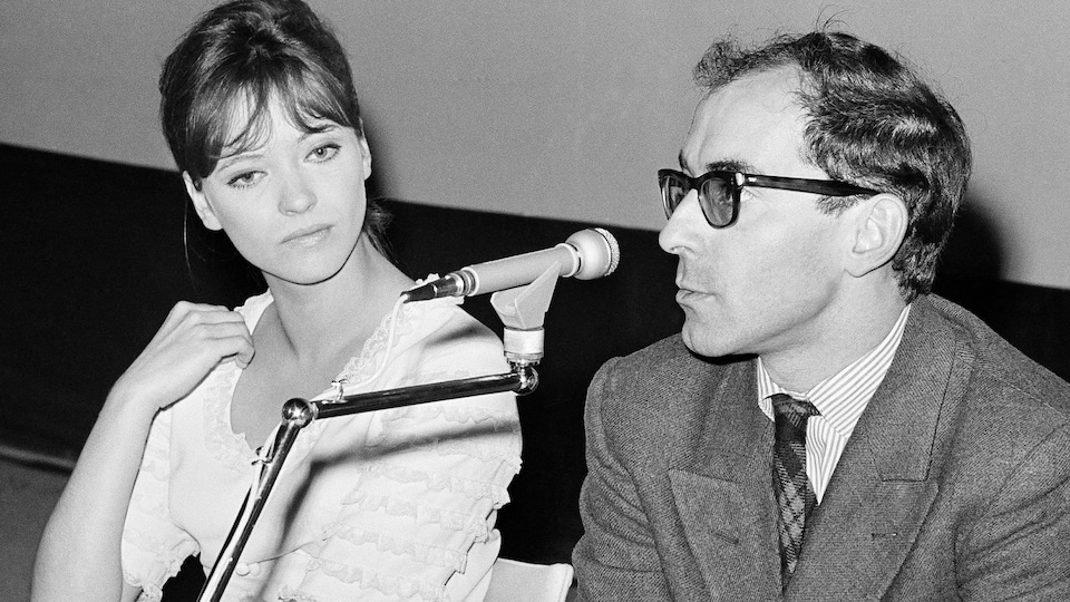 Jean-Luc Godard (right) and Anna Karina (left) during a press conference.