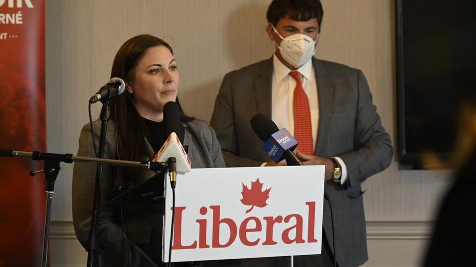 Mrs. Advin at a press conference with Dominic LeBlanc.