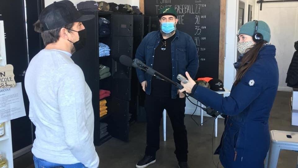 Fannie Bussières-McNicoll interviewed two men in a store, all wearing face masks.