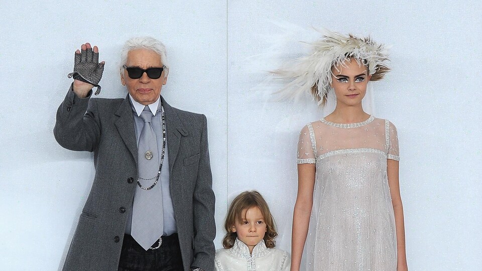 PARIS, FRANCE - JANUARY 21: (L-R) Designer Karl Lagerfeld, his godson Hudson Kroenig and model Cara Delevingne walk the runway during the Chanel show as part of Paris Fashion Week Haute-Couture Spring/Summer 2014 on January 21, 2014 in Paris, France. (Photo by Pascal Le Segretain/Getty Images)