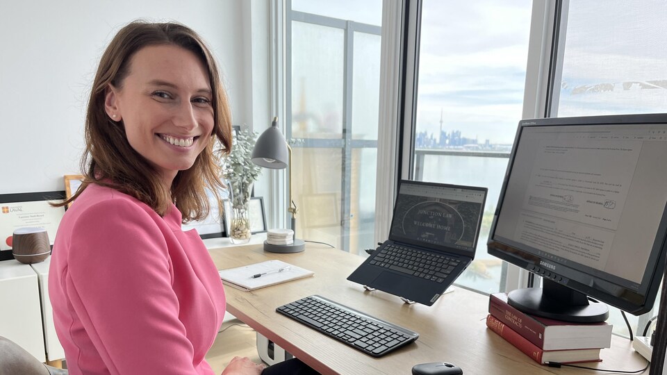 Attorney Laurence Dutil-Ricard, sitting at his desk.