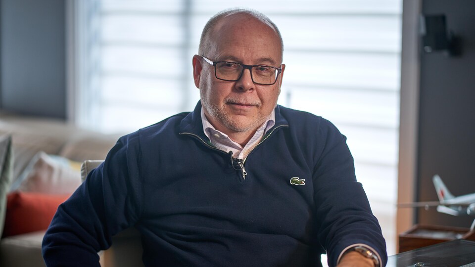 Louis Lévesque sat in his office.