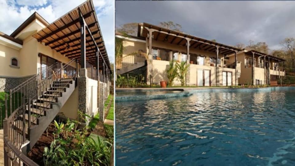Une maison avec une piscine.