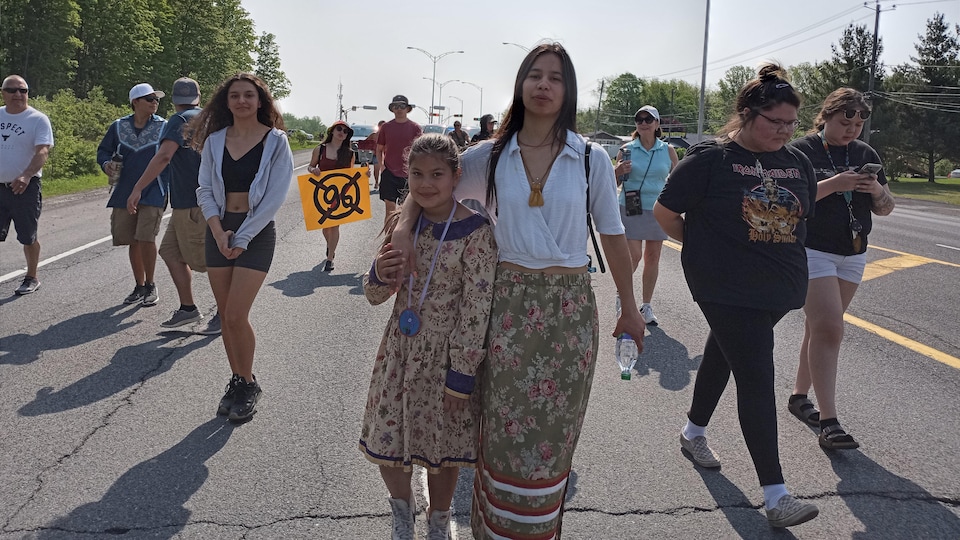 People are walking down the street.